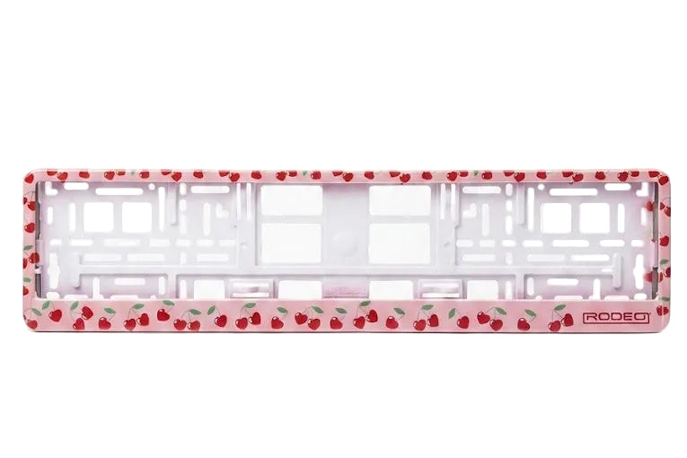 Marco portamatrículas vacío RODEO diseño Cherries. Fondo rosa con patrón repetido de cerezas y tallos verdes.