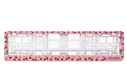 Marco portamatrículas vacío RODEO diseño Cherries. Fondo rosa con patrón repetido de cerezas y tallos verdes.